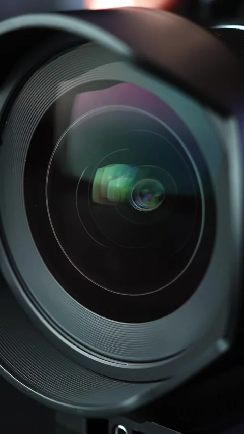 Macro shot of a camera lens as the aperture iris opens and closes, showing Stock Footage 333651334