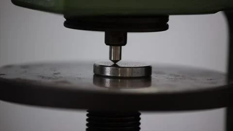 A macro shot captures the critical moment of a hardness test with a precision 스톡 동영상 320675201