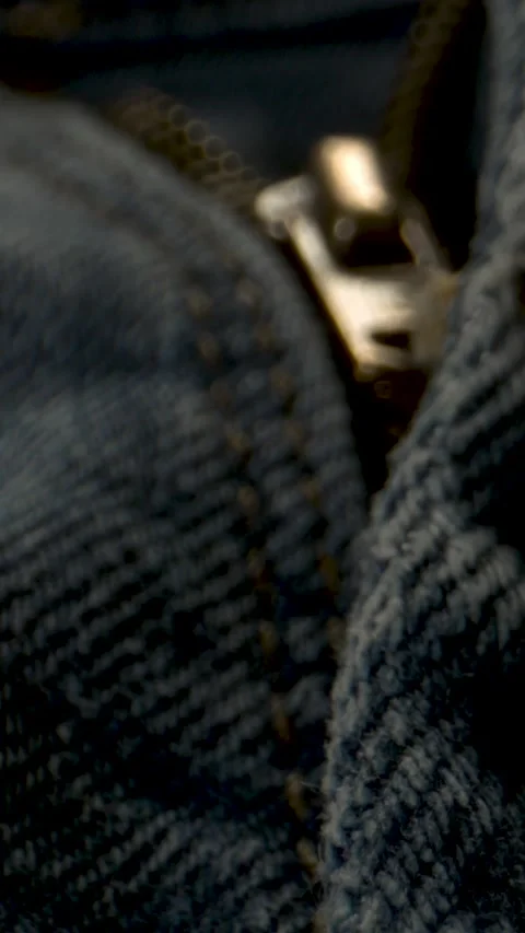 Macro Shot Capturing Zipper Mechanism Amid Cotton Ridges And Stitched Borders 스톡 동영상 335109133