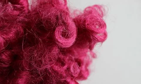 Macro shot of chaotically intertwined pink thread-like fibers Stock Photos