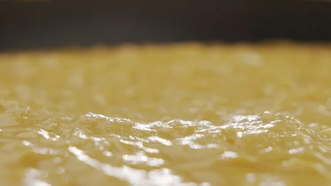 Macro shot of cheese sauce cooked in pan. Slow motion video Stock Footage 120401216