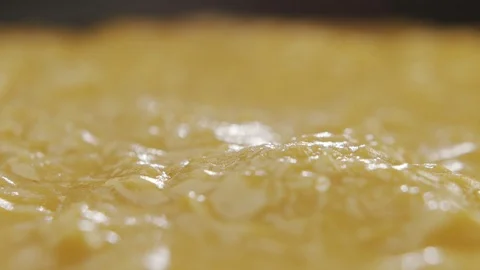 Macro shot of cheese sauce cooked in pan. Slow motion video Stock Footage 120401290