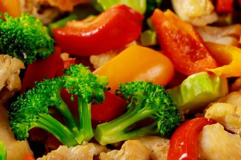 Macro shot of chopped and mixed fresh vegetables for salad. Stock Photos