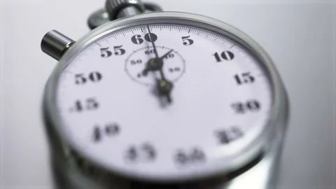 Macro shot of a classic metallic retro mechanical analog stopwatch Stock Footage 153162084
