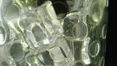 Macro shot of a clear glass with ice, black background. Stock Footage 131752991