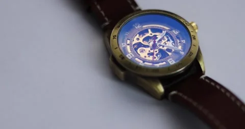 Macro Shot Clock Face and Internal Working Mechanism with Rapidly Rotating Ar Stock Footage 300363909