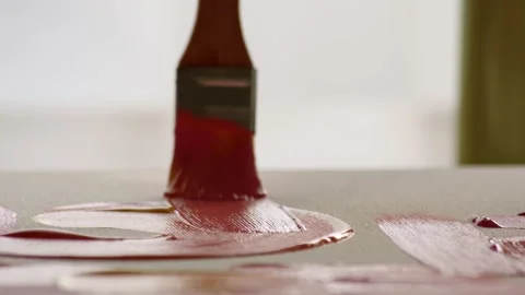 Macro shot close up of brush with pink paint that glides across canvas. artist Stock Footage 227603406