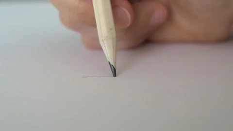 Macro shot Close-up of a pencil in the hand of the designer draws lines on paper Video stock 165532131