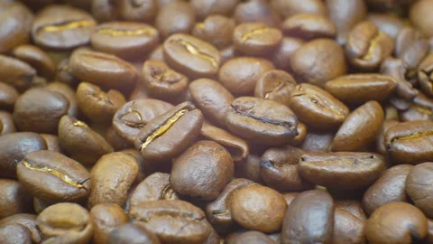 Macro shot of coffee beans moving from left to right. Stock Footage 107324645