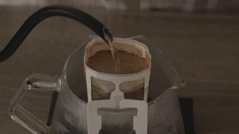 Macro shot of coffee blooming and rising in paper filter Stock Footage 335143403