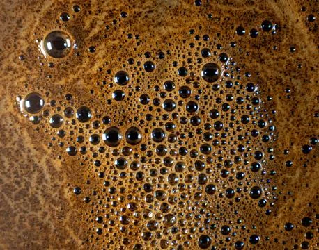 Macro shot of coffee foam bubbles texture surface pattern detail Stock Photos