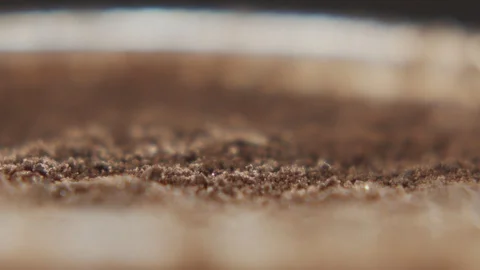 Macro shot of coffee sprinkled with chocolate chips in slow motion Stock Footage 120024965