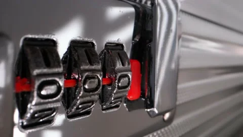 Macro shot of a combination lock in a metal suitcase Stock-Footage 168348846