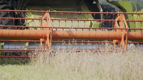Macro shot of a combine during the wheat harvest Stock Footage 171598580