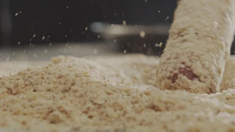 Macro shot of cooking corn dog, sausage in dough enveloped in breadcrumbs Stock Footage 117471076