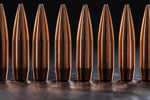 Macro shot of copper bullets that are in one row Stock-Fotos
