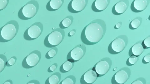 Macro Shot of Cosmetic moisturizing drops of liquid on a green-blue pastel 動画素材 182285669