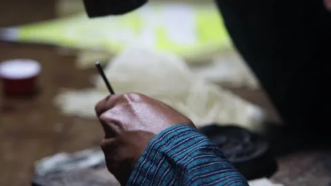 Macro shot craftsman hand using wooden hammer and metal punch tool to carve.. Stock Footage 344645384