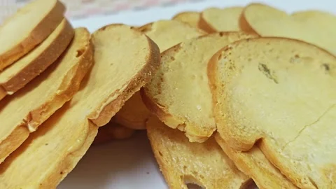 Macro shot of crispy baked bread rusks and toast texture background. 스톡 동영상 339991117
