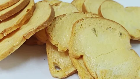 Macro shot of crispy baked bread rusks and toast texture background. 스톡 동영상 339991118
