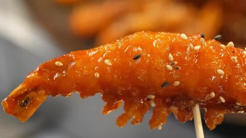 Macro Shot of Crispy Fried Shrimp Glazed in Sweet Chili Sauce with Sesame Seeds Stock-Footage 343027409