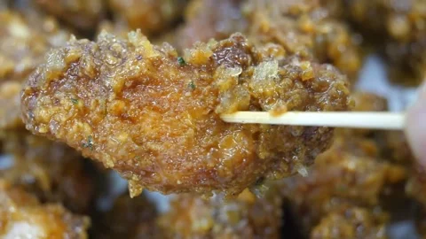 Macro Shot of Crispy Korean Fried Chicken on Toothpick Video stock 343028924