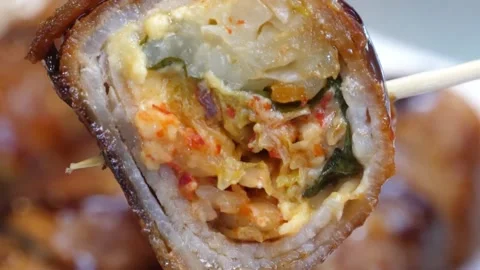 Macro Shot of Crispy Pork Belly Kimchi Roll on a Skewer Stock-Footage 343588100