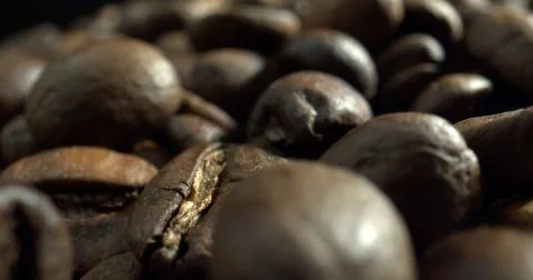Macro shot of dark roasted coffee beans. Stock Photos