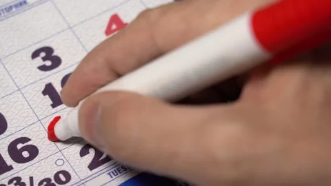 Macro shot date of month on calendar circled by red marker. Stock Footage 160907163