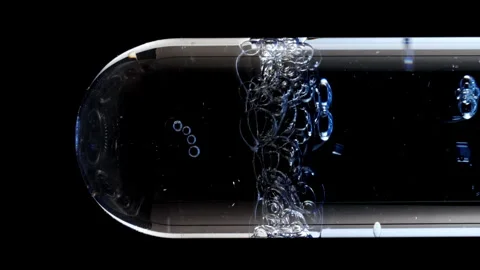 Macro Shot of Different Sized Blue Bubbles in descending in Glass Test Tube on Stock Footage 274149384