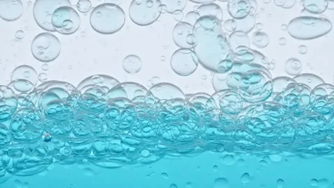 Macro Shot of Different Sized Clear Air Bubbles in Clear Water Rising up on Stock-Footage 262778851