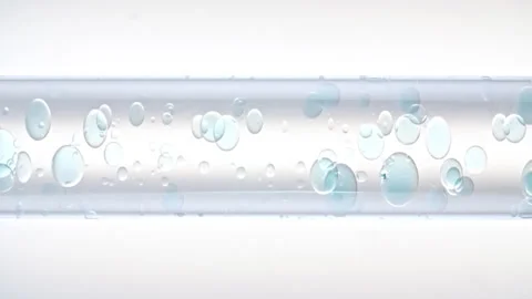 Macro Shot of Different Sized Clear Air Bubbles in Clear Water Rising up in Stock Footage 263726666