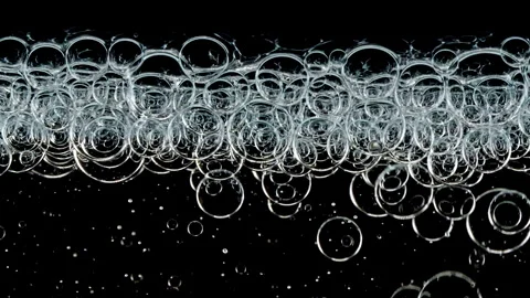 Macro Shot of Different Sized Clear Air Bubbles in Clear Water Rising up on Vídeo Stock 266940554