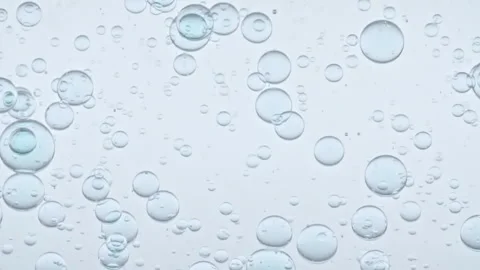 Macro Shot of Different Sized Clear Air Bubbles in Clear Water Rising up on Stock-Footage 267964034