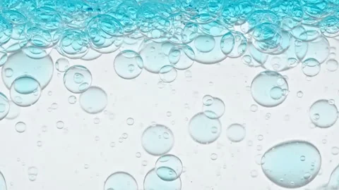 Macro Shot of Different Sized Clear Air Bubbles in Clear Water Rising up on Stock-Footage 267966979