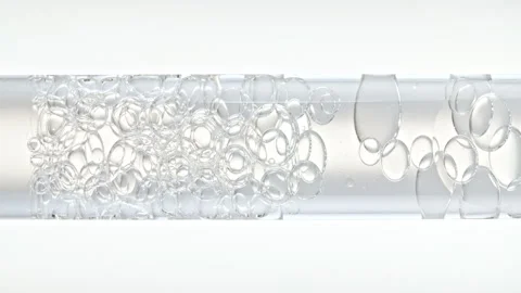 Macro Shot of Different Sized Clear Air Bubbles in Clear Water Rising up in Stock-Footage 267974055