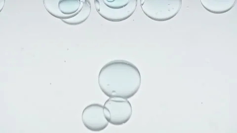 Macro Shot of Different Sized Clear Air Bubbles in Clear Water Rising up on Stock Footage 276529418