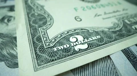 Macro shot of dollars. Stack of two dollars bills close-up. 스톡 사진