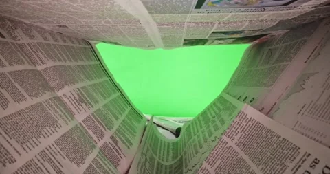 Macro shot in dolly through newspaper article in front of green screen Stock-Footage 179552451