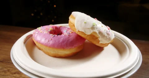 Macro shot of a donut with colored icing but spoiled, expired, covered in green Stock Footage 265184976