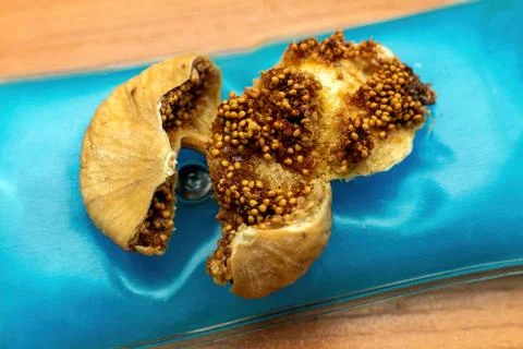 Macro shot of dried fig interior showing textured flesh and tiny seeds Stock Photos
