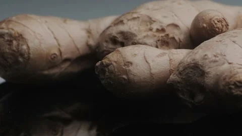 Macro shot of dried ginger roots - famous aromatic spice and plant. Video stock 141823023