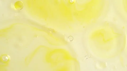 Macro shot of drops of orange essential oil  in water, rotate, top view.  C.. Stock Footage 274555627