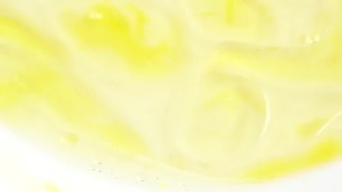 Macro shot of drops of orange essential oil  in water, rotate, top view.  C.. Stock Footage 281272847