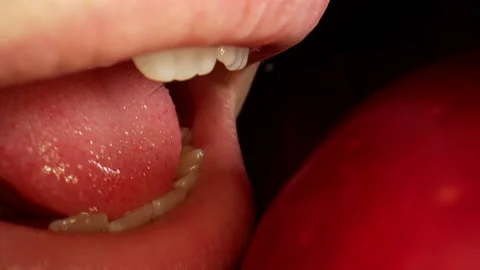 Macro shot of eating an apple. Slow motion. Macro food concept Stock-Footage 193083528