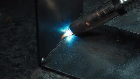 Macro Shot Of Electric Arc Welding Connecting Two Heavy Steel Pieces Stock Footage 337918149