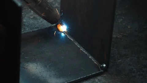 Macro Shot Of Electrical Arc Welding Process On Steel Corner Joint Stock Footage 338373041
