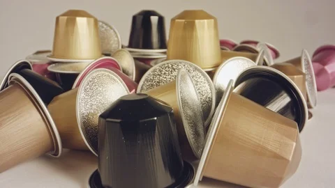 Macro shot of espresso capsules in various colors and flavors Stock Footage 109102640