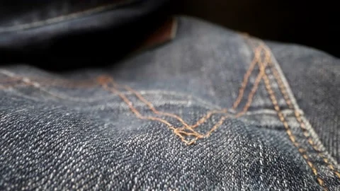 Macro shot of fabric of denim pants, modern fashion and casual style, clothes Vidéo 236534397