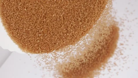 Macro shot of falling brown sugar, Brown sugar falling view Stock Footage 148220913